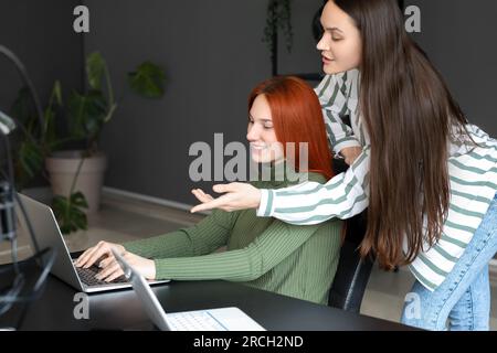Female programmers working in office Stock Photo