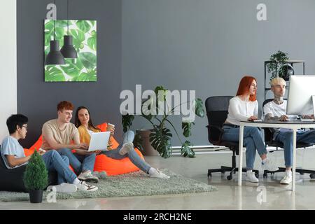 Team of young programmers working in office Stock Photo