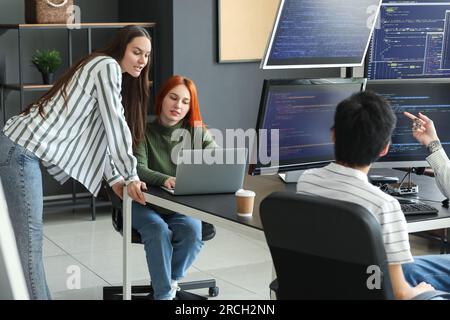 Female programmers working in office Stock Photo
