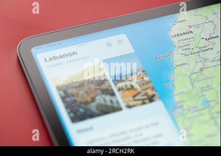 New York, USA - July 6, 2023: Boarder line on Lebanon country with info on world apple map ipad macro close up view Stock Photo