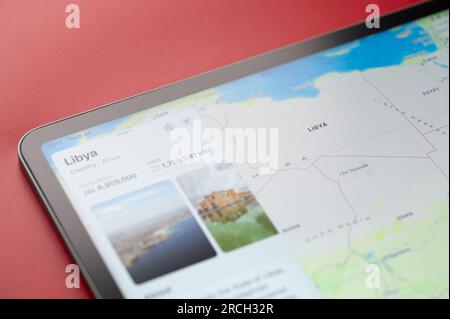 New York, USA - July 6, 2023: Libya country on world map in screen of ipad tablet close up view Stock Photo