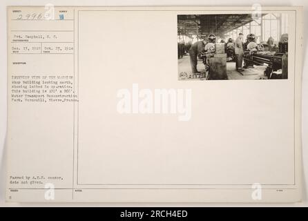 Interior view of a machine shop building at the Motor Transport Reconstruction Park in Verneuill, Nievre, France. In the photo, lathes can be seen in operation. The building measures 100' x 260'. The photograph was taken on October 23, 1918, by Pvt. Campbell, S. C. and received on December 13, 1919. It has been passed by the A.E.F. censor, but the exact date is not provided. Stock Photo