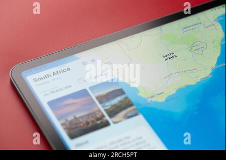 New York, USA - July 6, 2023: Contour of South Africa country on world map with info about populatian and area in apple ipad macro close up view Stock Photo