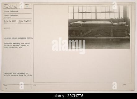 Corporal Palumbo is seen inspecting standard crating for heavy aviation trucks at Camp Holabird, Maryland, on October 31, 1918. The photograph was taken by an unknown photographer on November 4, 1918. It was censored and released by the M.I.D. censor on November 6, 1918. The image shows Corp. Palumbo inspecting the trucks, with a cushion visible in the background. Stock Photo