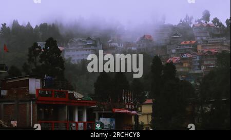 Mirik, West Bengal, India - 27th June 2023: Mist, fog and clouds covered Mirik hill station and townscape in monsoon season, West Bengal in India Stock Photo