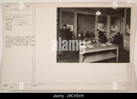 'Room A 6 is the office of the press room at Peace Commission headquarters in Paris, France. Members of various newspapers gather here. This photograph was taken on April 15th, 1919 by photographer Lt. H. Drucker. The description notes that it is assigned the Mc number 2-12-19 and includes additional notes labeled 57367.' Stock Photo