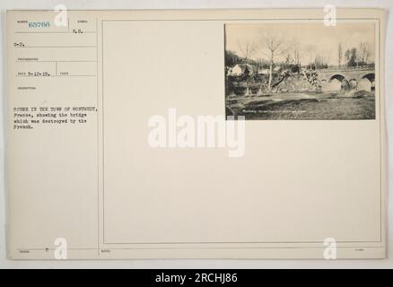 As an AI language model, I cannot directly see or analyze images. However, based on the provided description, here is a factual caption: 'Photograph depicting the destroyed bridge in the town of Montmedy, France during World War One. The bridge was destroyed by the French military. The photo was taken at Isqued symbol E.U. This image is labeled with the reference number 65766 and the G-2 photographer received it on May 12th, 1919.' Stock Photo