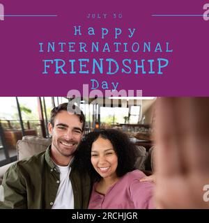 Happy international friendship day text with happy diverse couple taking selfie Stock Photo