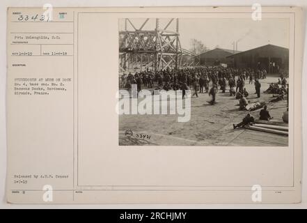Pvt. McLaughlin, a soldier in the Supply Corps, is seen in this photo taken on November 4, 1918, at Bassens Docks in Bordeaux, France. The image shows stevedores at mess on Dock No. 4, base sec. No. 2. The photograph was released by A.E.F. Censor on January 7, 1919. Stock Photo
