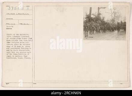 'Troops of the 2nd Battalion, 125th Infantry (composed of detachments from former 33rd Mich. Inf. and 31st Mich. Inf.) of the 32nd Division going into reserve after 20 days in the lines and continuous fighting. The condition of the roads is typical, with rain falling for the greater part of the time. Near Montfaucon, Meuse, France.' Stock Photo