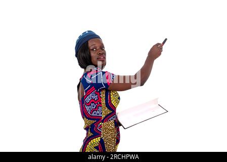 portrait of a beautiful young female teacher explaining the lesson on a whiteboard in a classroom. Stock Photo