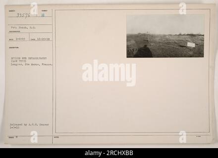 American soldier, Private Boach from South Carolina, seen in this photograph taken on November 20, 1918, at Langres, Hte Marne, France. The image shows a low-type spider web entanglement used for defense purposes during World War One. This photograph was released by the A.E.F. Censor on January 7, 1919. Stock Photo