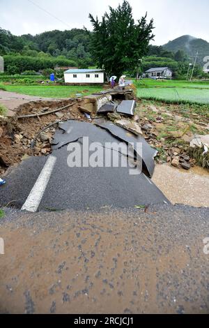 (230715) -- SEOUL, July 15, 2023 (Xinhua) -- A collapsed road is seen in Yecheon county of North Gyeongsang Province, South Korea, July 15, 2023. Heavy rains in South Korea had left at least seven people dead, three missing and seven others injured, Yonhap news agency said Saturday citing relevant authorities. (NEWSIS via Xinhua) Stock Photo