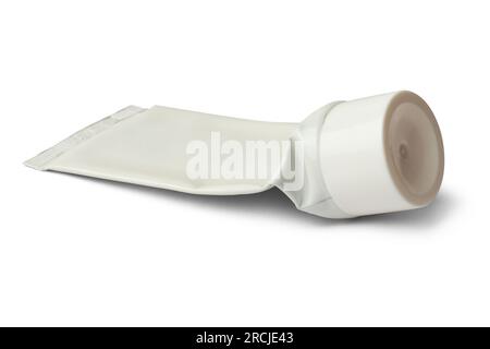 close-up of used empty tube with white cap, mock-up template for toothpaste, cream, gel or shampoo, blank package isolated on white background Stock Photo