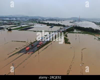 (230715) -- SEOUL, July 15, 2023 (Xinhua) -- Staff members conduct drainage work at an underpass in Cheongju of North Chungcheong Province, South Korea, July 15, 2023. Heavy rains in South Korea had left at least seven people dead, three missing and seven others injured, Yonhap news agency said Saturday citing relevant authorities. (NEWSIS via Xinhua) Stock Photo