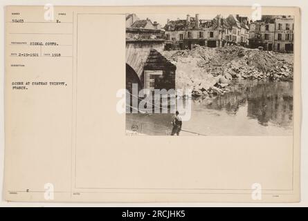 Soldiers walking through the ruins of Chateau Thierry, France during World War One. The photograph captures the devastation and destruction caused by the war. Taken in 1918 by the Signal Corps. Symbol Reco 2-19-1921. Image number 504037. Stock Photo