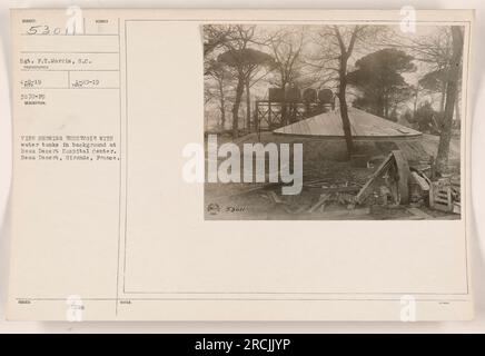 Reservoir with water tanks in the background at Beau Desert Hospital Center in Gironde, France. This photograph, taken on April 8, 1919, by Sgt. F.T. Morris, depicts the hospital's water storage facilities. The image is part of the collection of American Military Activities during World War One and is labeled as issue number 29-19. DDMC (Department of Defense Media Center) has made note of this image under the reference number 53011. Stock Photo