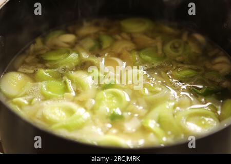 Leak and potato soup in a brown dish Stock Photo