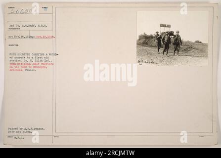 Four soldiers from Company E, 311th Infantry, 78th Division, carrying a wounded comrade to a first aid station near Cheviers on the road to Grandpre, Ardennes, France. The image was taken by 2nd Lt. A.C. Duff, S.R.C. Photo was passed by A.E.F. censor, date unknown. Stock Photo