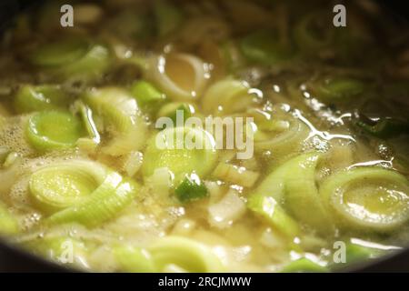 Leak and potato soup in a brown dish Stock Photo
