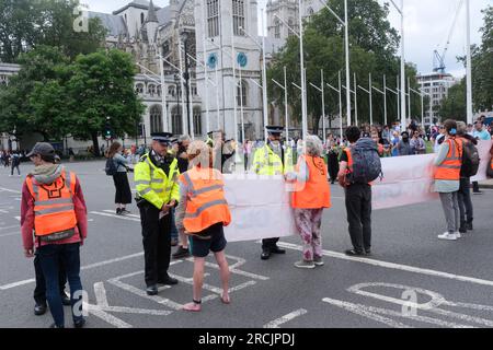 Parliament Square, London, UK. 15th July 2023. Members of Just Stop Oil protesting in Parliament Square. Credit: Matthew Chattle/Alamy Live News Stock Photo