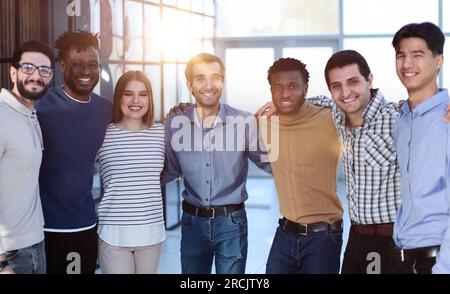 Positive multi racial corporate team posing looking at camera Stock Photo