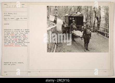 'Factual caption for image 111-SC-24586: A dressing station in Amphersbach, Alsace, Germany with soldiers from the 137th Ambulance Company receiving a patient. The soldiers pictured include Pvt. Harry C. Peck, Pvt. Ives, Cpl. Louis A. Worthington, and Pvt. R.C. Capes. The photograph was taken on November 3, 1918 by photographer R.C. Price. This image was received on August 31, 1918.' Stock Photo