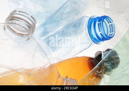 Transparent plastic bottle crumpled plastic recycling waste sorting. Pile of bottles PET recycling bottles background. Crushed bottle smashed plastic Stock Photo