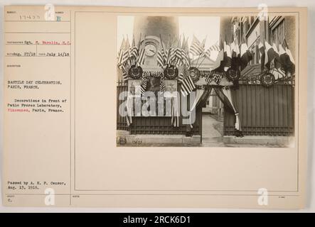 Decorations in front of Pathe Preres Laboratory in Vincennes, Paris, France during the Bastille Day celebration on July 14, 1918. The photograph was taken by Sgt. S. Warolin, S.C. and was issued by the A. E. P. Censor on August 13, 1918. Stock Photo