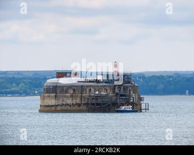 Spitbank fort a sea fort located in the Solent near Portsmouth Hampshire England with The Isle of Wight in the background Stock Photo