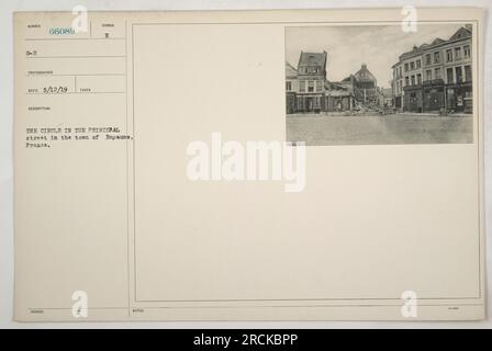 A photograph depicting the circle located in the principal street of Bapaume, France during World War One. The photo was taken on an unspecified date and recorded under number G-2, with the photographer's code being 66089. It was issued with a symbol as part of the documentation. The caption provides no further description or details. Stock Photo