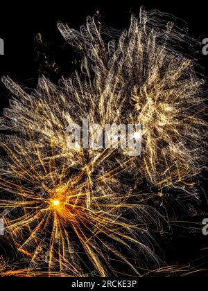 Abstract 5-second long exposure of public firework display celebrating the 14th of July - La Roche Posay, Vienne (86), France. Stock Photo
