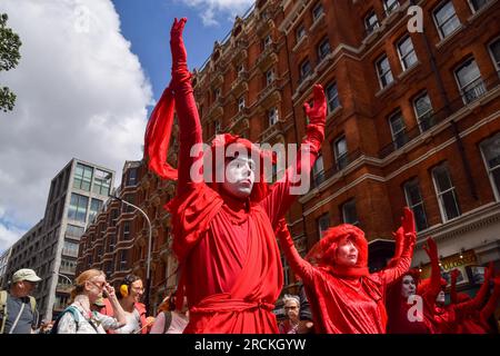 London, England, UK. 15th July, 2023. Extinction Rebellion's Red Rebels join the march. Climate activists marched from the Department for Energy Security and Net Zero to Equinor offices in protest against Rosebank oil and gas field. (Credit Image: © Vuk Valcic/ZUMA Press Wire) EDITORIAL USAGE ONLY! Not for Commercial USAGE! Credit: ZUMA Press, Inc./Alamy Live News Stock Photo