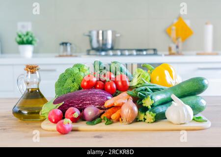 Set of fresh raw vegetables  on a white wooden table in a modern kitchen. Eat healthy. Organic food. Stock Photo