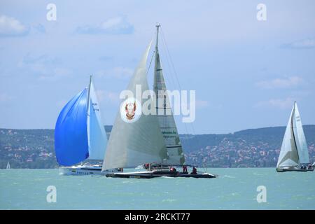 Lake of Balaton, Hungary Europe. 06 July 2023: Group of sailboats sail in windy weather in the turquoise waters of the Lake Balaton Plattensee during Stock Photo