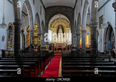 Interior view of the 16th century Igreja de São Miguel Arcanjo and altar in the historic village of Vila Franca do Campo in Sao Miguel Island, Azores, Portugal. The village was established in the middle of the 15th century by Gonçalo Vaz Botelho. Stock Photo