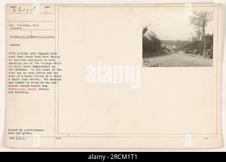 Caption: 'A view of the village of Nantillois, Meuse, France, during World War One. The photograph shows an American ambulance racing out of the village, which is still being attacked by German forces. Debris and the body of a horse, killed by a shell, can be seen on the right side of the road.' Stock Photo