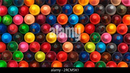 Collection of colorful crayons mixed together Stock Photo