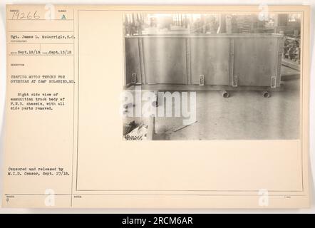 Sgt. James L. McGarrigle of the U.S. Signal Corps is seen in this photo at Camp Holabird, Maryland, on September 15, 1918, crating motor trucks for overseas deployment. The image shows a right side view of ammunition truck body on a F.W.D. chassis, with side parts removed. This photo was censored and released by the M.I.D. censor on September 27, 1918. The photo is labeled as 111-SC-19266 and marked as an issue C. Stock Photo