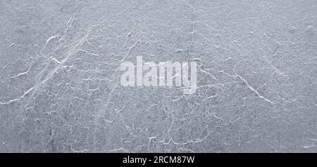 Rough texture of crumpled silver or aluminum foil. Stock Photo