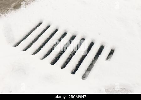 Storm drainage covered in snow. Stock Photo