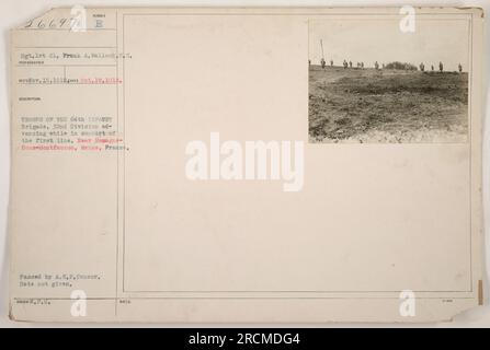 Troops of the 64th Infantry Brigade, 32nd Division advancing in support of the first line. Location: near Romagne-Sous-Montfaucon, Meuse, France. The photograph was taken by Sgt. Frank A. Wallock. The exact date of the image is not provided, but it was passed by the A.E.F.Censor and issued with W.C. Notes: 6697. Stock Photo