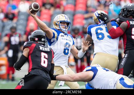 Ottawa, Canada. 15th July, 2023. Winnipeg Blue Bombers quarterback Zach Collaros (8) launches a pass during the CFL game between Winnipeg Blue Bombers and Ottawa Redblacks held at TD Place Stadium in Ottawa, Canada. Daniel Lea/CSM/Alamy Live News Stock Photo