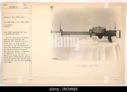 The image shows a Lewis machine gun designed for use on U.S. airplanes during World War One. Similar to those used by the British and French Air Service, these guns were planned to be mounted on American airplanes being constructed for the western front. The spade handle design allowed for faster handling by aviators. Photograph taken in May 1918. Promotional information includes the serial number, photographer's details, and official purpose of the image. Stock Photo
