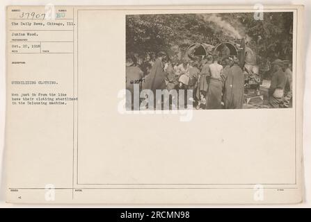 In this photograph, taken on October 20, 1918, soldiers who have returned from the front line can be seen having their clothing sterilized in the Delousing Machine. This process aimed to remove any potential contaminants from their uniforms. The image is a part of the collection from the Daily News in Chicago, Illinois. Stock Photo