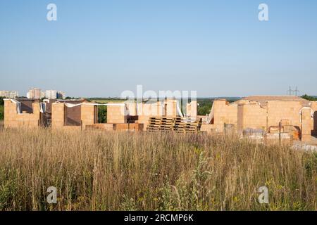 Construction site with new partitioning walls from thermo brick blocks. Red clay Ceramic Thermo Bricks construction material. a private house on the o Stock Photo