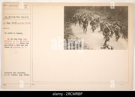 Soldiers of the United States Army traveling from Camp Merritt, NJ, en route to France during World War One. They are on their way from Alpine Landing, NJ to Hoboken, NJ, where they will board a boat. This photograph was taken on July 30, 1918, and censored and released by the military on August 23, 1918. Stock Photo