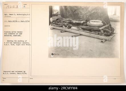 Sgt. James L. McGarrigle is seen in this image packing motor trucks for deployment overseas at Camp Holabird, Maryland during World War One. The photograph shows a 3/4-ton ambulance chassis, G.M.C. being prepared for transportation. This image was censored and released by the M.I.D. Censor on September 27, 1918. Stock Photo