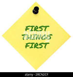 First Things First reminder green marker handwritten motivational text important crucial business priority action planning management concept metaphor Stock Photo