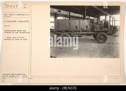 Sgt. James L. McGarrigle is seen crating motor trucks for overseas deployment at Camp Holabird, MD. The right side of a F.W. D. truck is displayed, showcasing all body parts. This image was taken on September 15, 1918, and was censored and released by the M.I.D Censor on September 27, 1918. Stock Photo